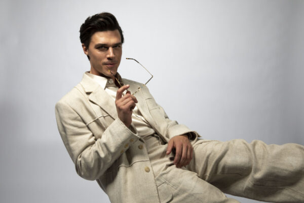 GQ Finn Whittrock Photoshoot White Suit Eye Glasses Leaning Back