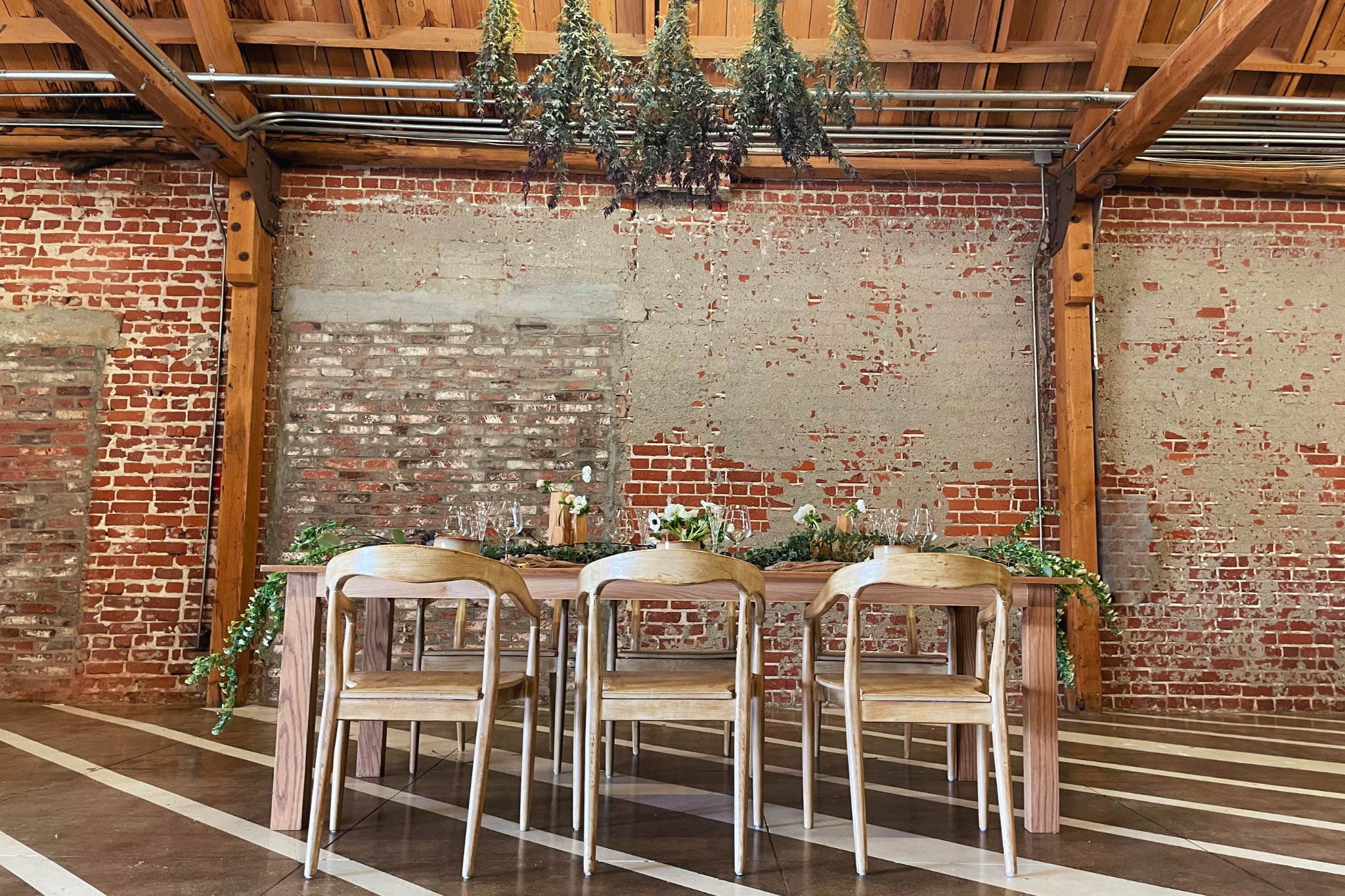 MG Studio Wedding Table with Hanging Floral - brick walls