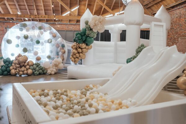 white bounce house and ball pit in MG Studio event space